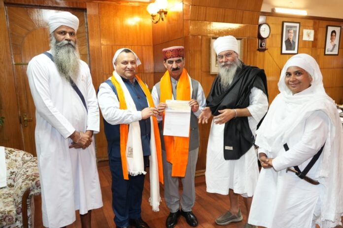 Ayush Minister Yadvinder Goma presenting  cheques worth Rs. 62000 to Chief Minister Thakur Sukhvinder Singh
